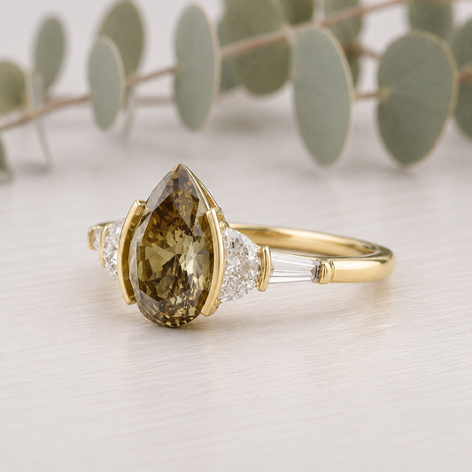 Pear Cut Fancy Color Diamond Ring featuring a 1.38 CT pear cut fancy color diamond with brown yellow tones, accented by lab-grown diamonds in a classic contemporary setting with a straight shank and slim 1.8 mm band, designed as a unique engagement ring.