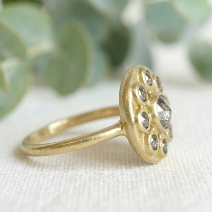 Antique Cut Salt and Pepper Diamond Ring, Vintage Style, featuring a round rose-cut salt-and-pepper diamond center stone surrounded by smaller rose-cut diamonds in a yellow gold cluster setting.