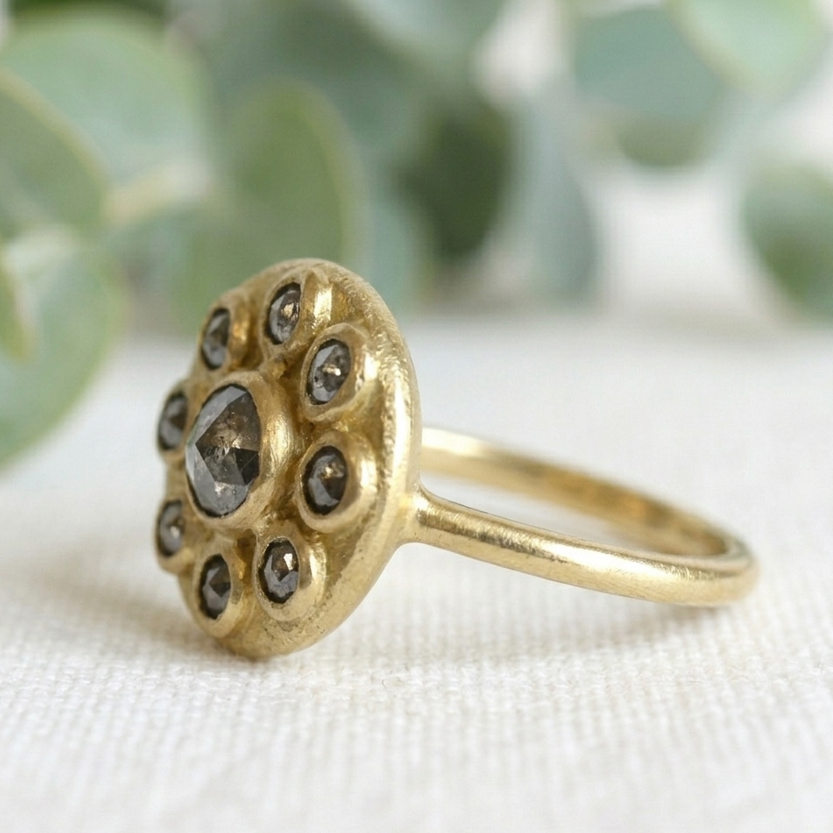 Antique Cut Salt and Pepper Diamond Ring, Vintage Style, featuring a round rose-cut salt-and-pepper diamond center stone surrounded by smaller rose-cut diamonds in a yellow gold cluster setting.