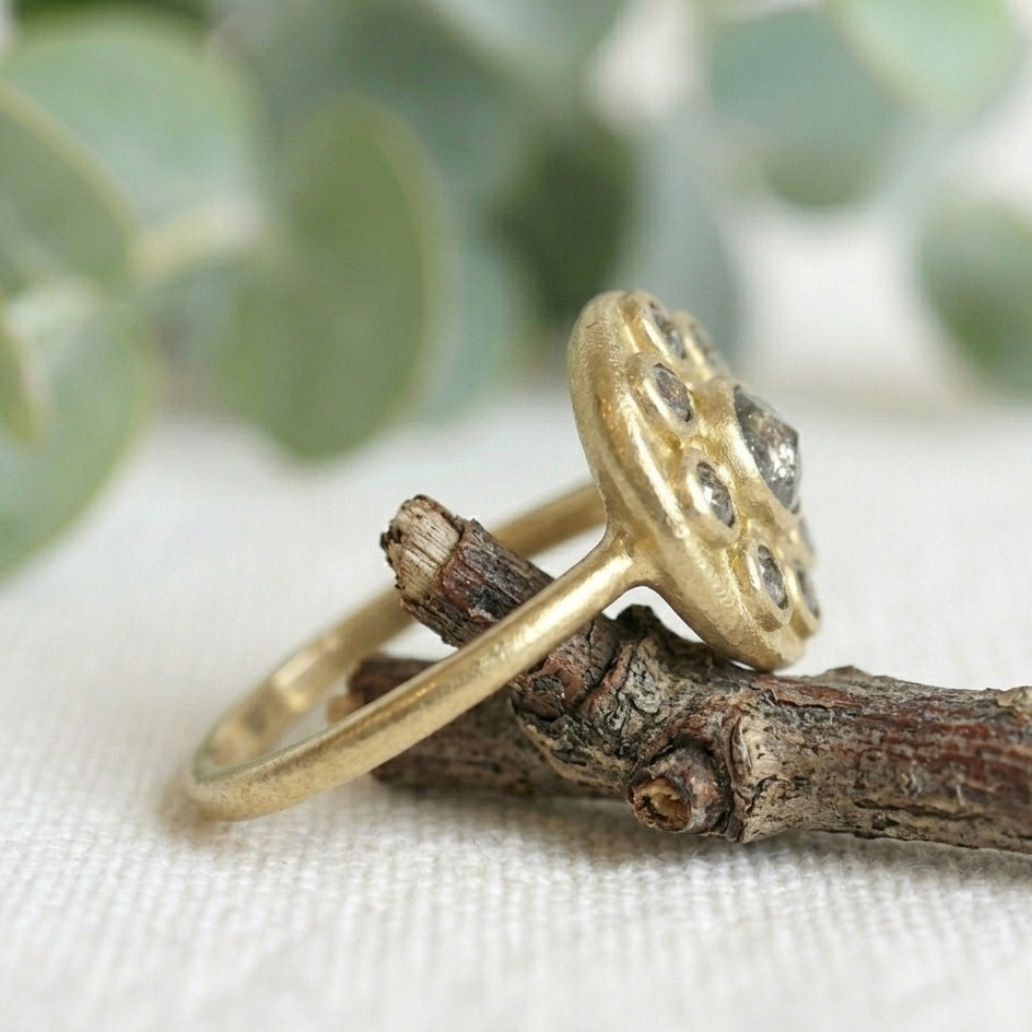 Antique Cut Salt and Pepper Diamond Ring, Vintage Style, featuring a round rose-cut salt-and-pepper diamond center stone surrounded by smaller rose-cut diamonds in a yellow gold cluster setting.