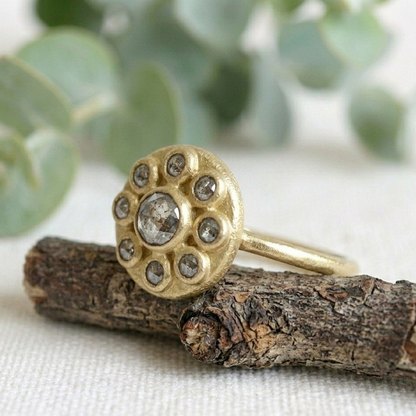 Antique Cut Salt and Pepper Diamond Ring, Vintage Style, featuring a round rose-cut salt-and-pepper diamond center stone surrounded by smaller rose-cut diamonds in a yellow gold cluster setting.