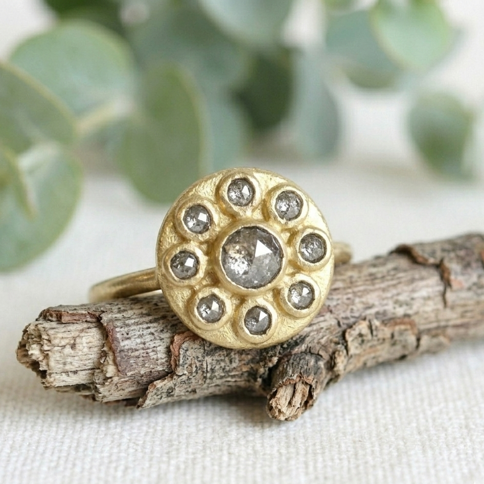 Antique Cut Salt and Pepper Diamond Ring, Vintage Style, featuring a round rose-cut salt-and-pepper diamond center stone surrounded by smaller rose-cut diamonds in a yellow gold cluster setting.