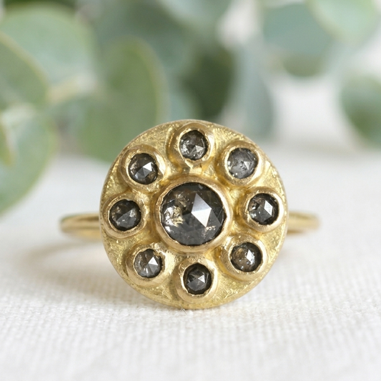 Antique Cut Salt and Pepper Diamond Ring, Vintage Style, featuring a round rose-cut salt-and-pepper diamond center stone surrounded by smaller rose-cut diamonds in a yellow gold cluster setting.