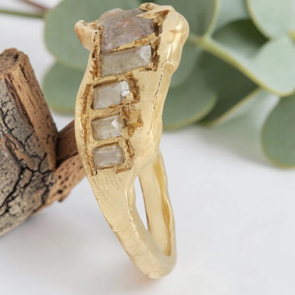 Baguette Cut Milky Diamond Ring featuring a 1.20 CT milky diamond center stone accented by two baguette cut milky diamond side stones in a handcrafted three stone design with a reverse tapered band and modern vintage inspired fine jewelry aesthetic.