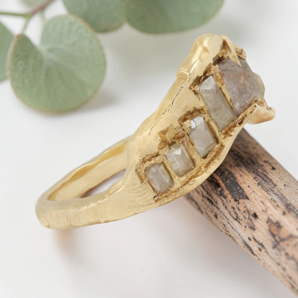 Baguette Cut Milky Diamond Ring featuring a 1.20 CT milky diamond center stone accented by two baguette cut milky diamond side stones in a handcrafted three stone design with a reverse tapered band and modern vintage inspired fine jewelry aesthetic.