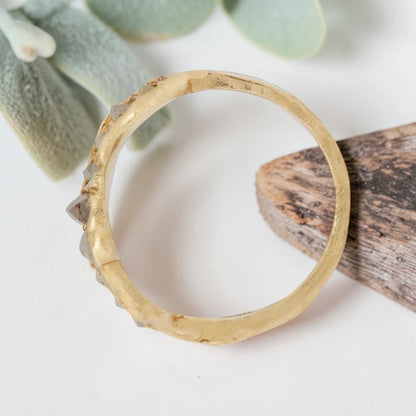 Baguette Cut Milky Diamond Ring featuring a 1.20 CT milky diamond center stone accented by two baguette cut milky diamond side stones in a handcrafted three stone design with a reverse tapered band and modern vintage inspired fine jewelry aesthetic.