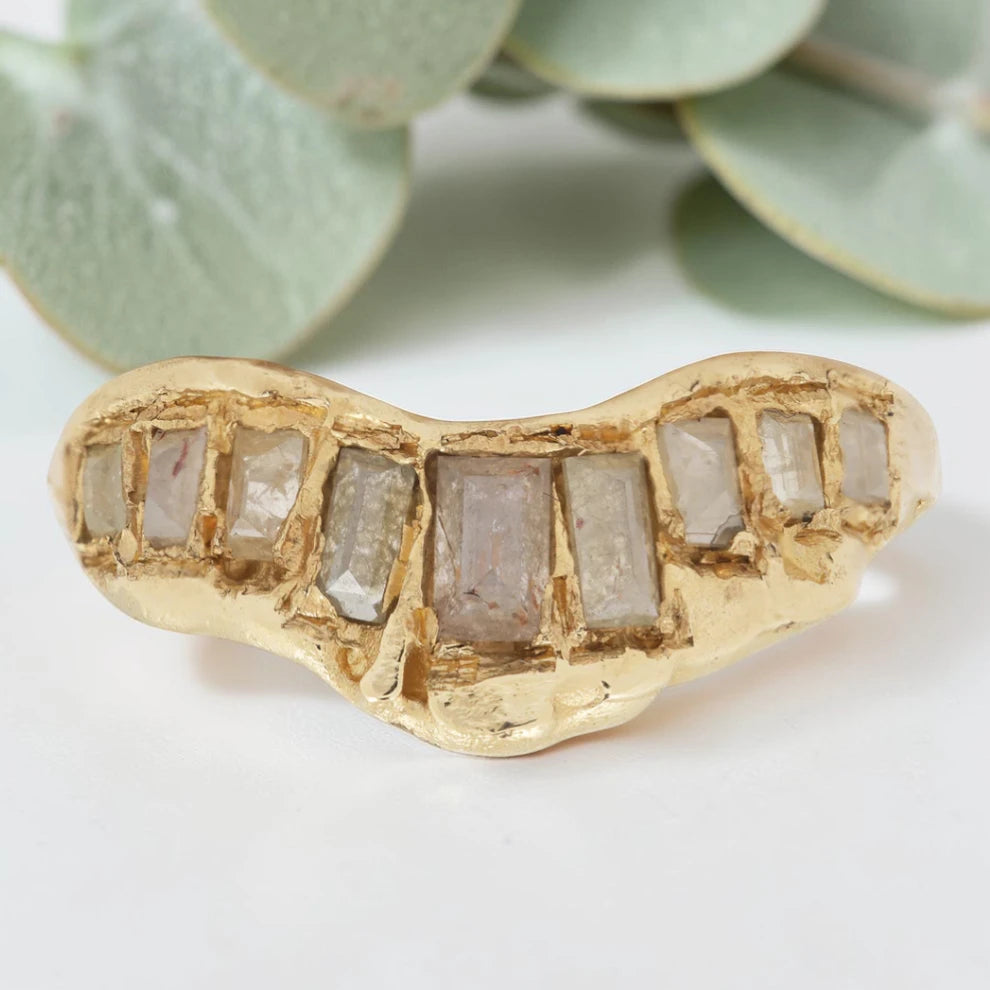 Baguette Cut Milky Diamond Ring featuring a 1.20 CT milky diamond center stone accented by two baguette cut milky diamond side stones in a handcrafted three stone design with a reverse tapered band and modern vintage inspired fine jewelry aesthetic.