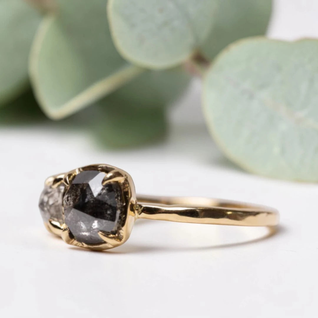 Cushion rose cut salt and pepper diamond two stone ring featuring a 1.80 CT center diamond and 0.65 CT companion diamond with natural inclusions, handcrafted on a minimalist straight band alternative engagement design.
