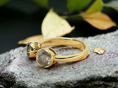 Dual Stone Diamond Ring Handmade Alternative Engagement Ring featuring two round rose cut natural salt and pepper diamonds in a yellow gold bezel setting with an open front minimalist design and straight shank.