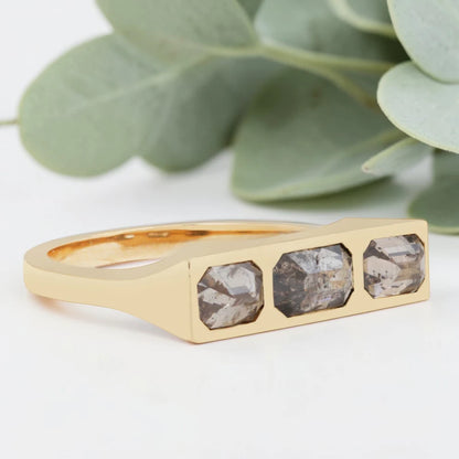 Emerald cut salt and pepper diamond bezel statement ring featuring a 1.20 CT natural center stone with two emerald cut side stones, handcrafted in a bold 4.50 mm reverse tapered minimalist fine jewelry design.