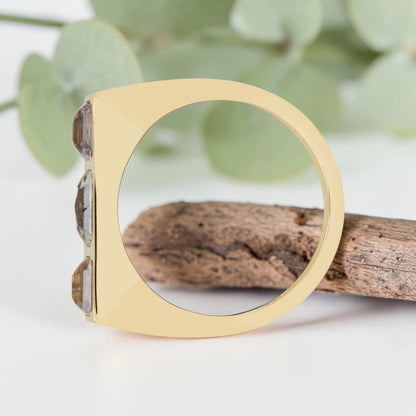 Emerald cut salt and pepper diamond bezel statement ring featuring a 1.20 CT natural center stone with two emerald cut side stones, handcrafted in a bold 4.50 mm reverse tapered minimalist fine jewelry design.