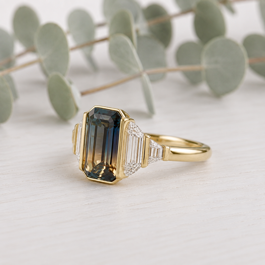 Emerald Cut Sapphire Diamond Ring featuring an approximate 2.00 CT rich blue natural sapphire accented by lab-grown diamonds in a minimalist contemporary setting with a slim 1.6 mm band, designed as a unique engagement ring.