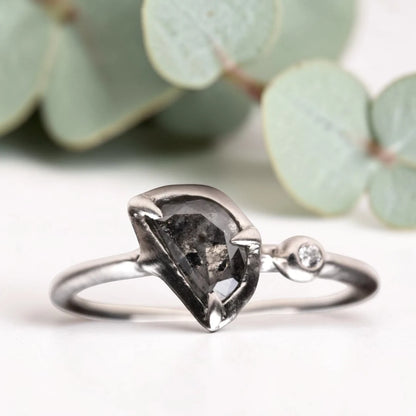 Half moon rose cut salt and pepper diamond statement engagement ring featuring a 1.35 CT natural center stone with galaxy-like inclusions and 1.00 CT round diamond accents on a handcrafted reverse tapered band.
