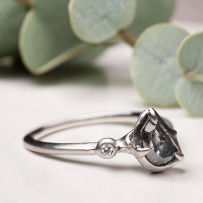 Half moon rose cut salt and pepper diamond statement engagement ring featuring a 1.35 CT natural center stone with galaxy-like inclusions and 1.00 CT round diamond accents on a handcrafted reverse tapered band.