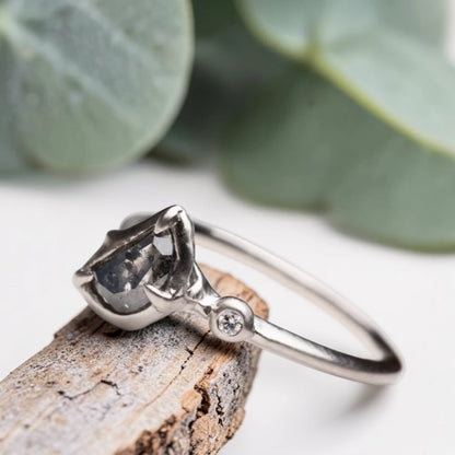 Half moon rose cut salt and pepper diamond statement engagement ring featuring a 1.35 CT natural center stone with galaxy-like inclusions and 1.00 CT round diamond accents on a handcrafted reverse tapered band.