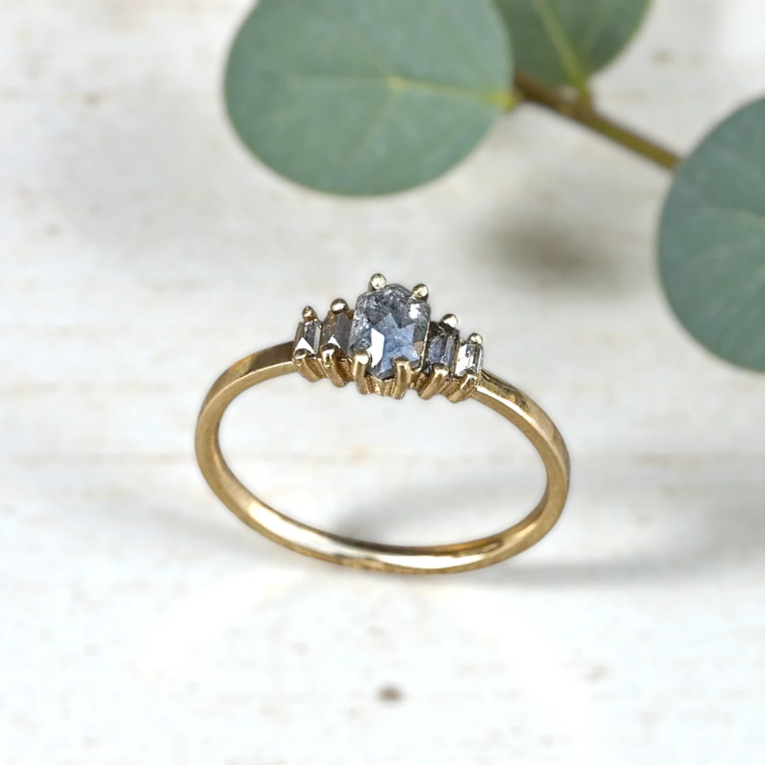 Handcrafted natural grey diamond ring featuring a unique engagement design with an organic grey diamond center stone set in a minimalist fine jewelry style band, showcasing raw natural inclusions and artisan craftsmanship.