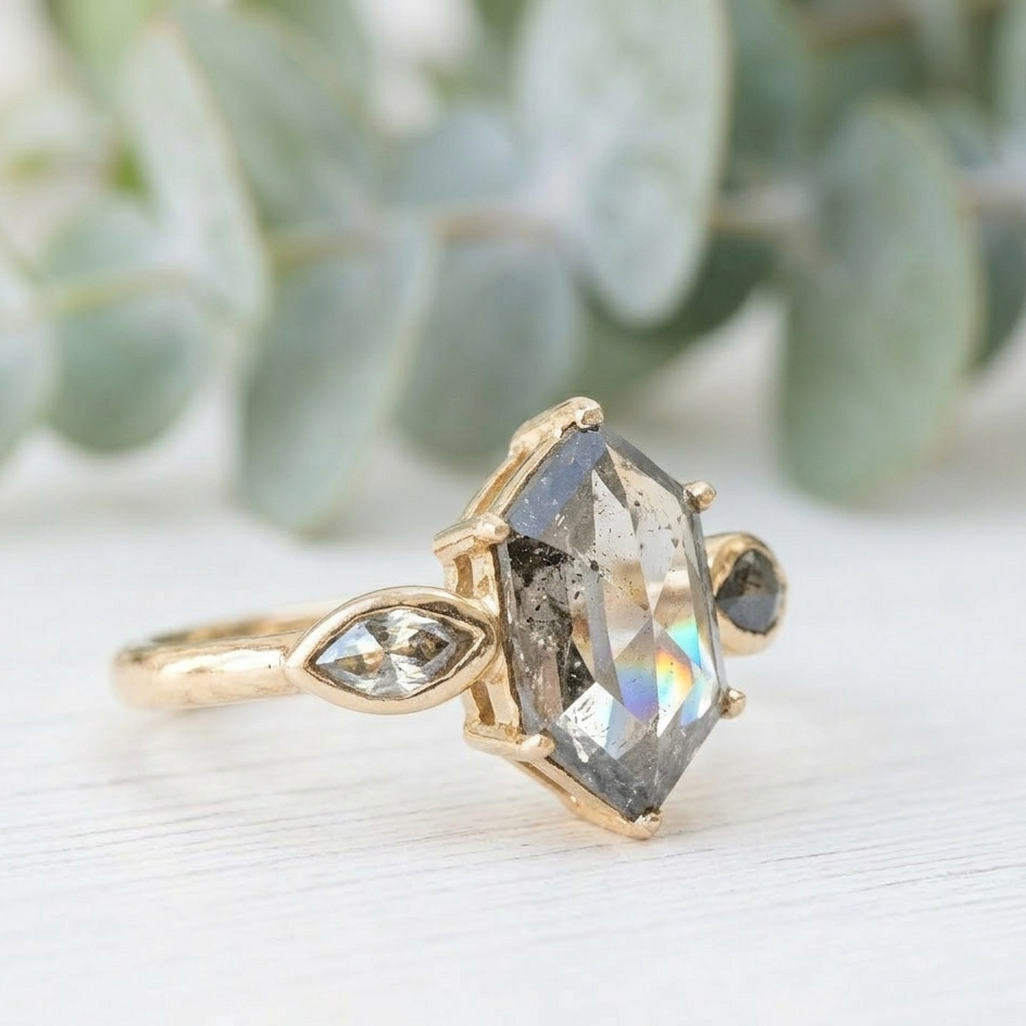 Hexagon Cut Salt and Pepper Diamond Ring featuring a 2.12 CT natural salt and pepper hexagon diamond with organic inclusions, accented by two pear cut salt and pepper diamonds in a minimalist geometric engagement design with a straight 1.6 mm band and handcrafted fine jewelry aesthetic.