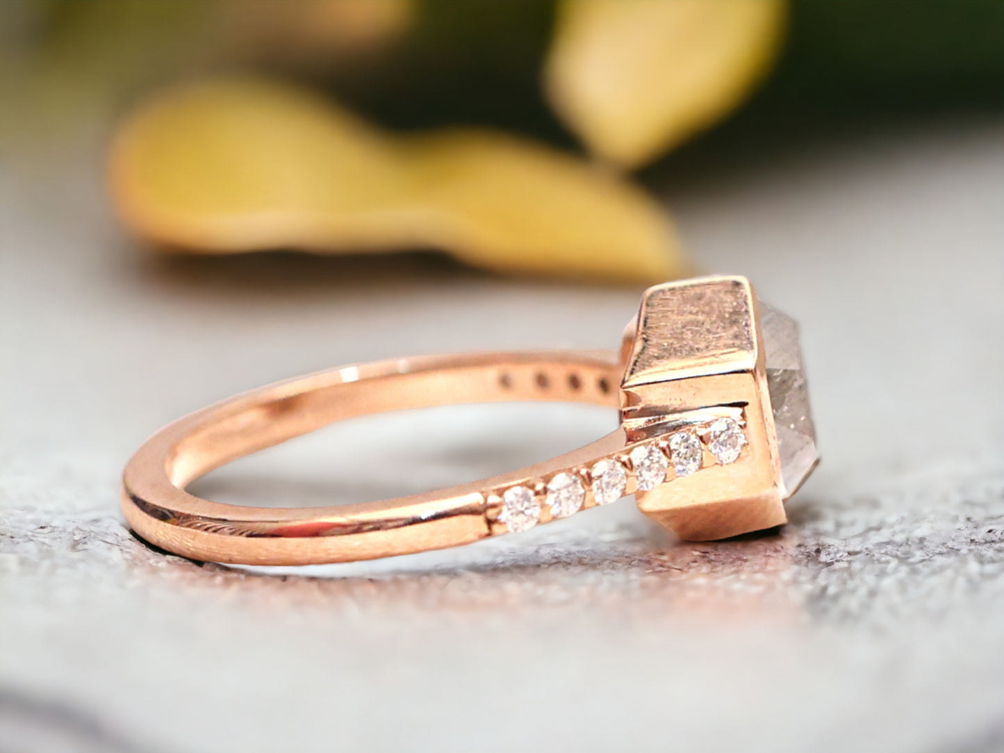 Hexagon Salt and Pepper Diamond Ring featuring a 1.27 CT natural salt and pepper hexagon cut diamond with galaxy-like inclusions, accented by round brilliant diamond side stones in a minimalist straight 1.6 mm band, handcrafted fine jewelry design.