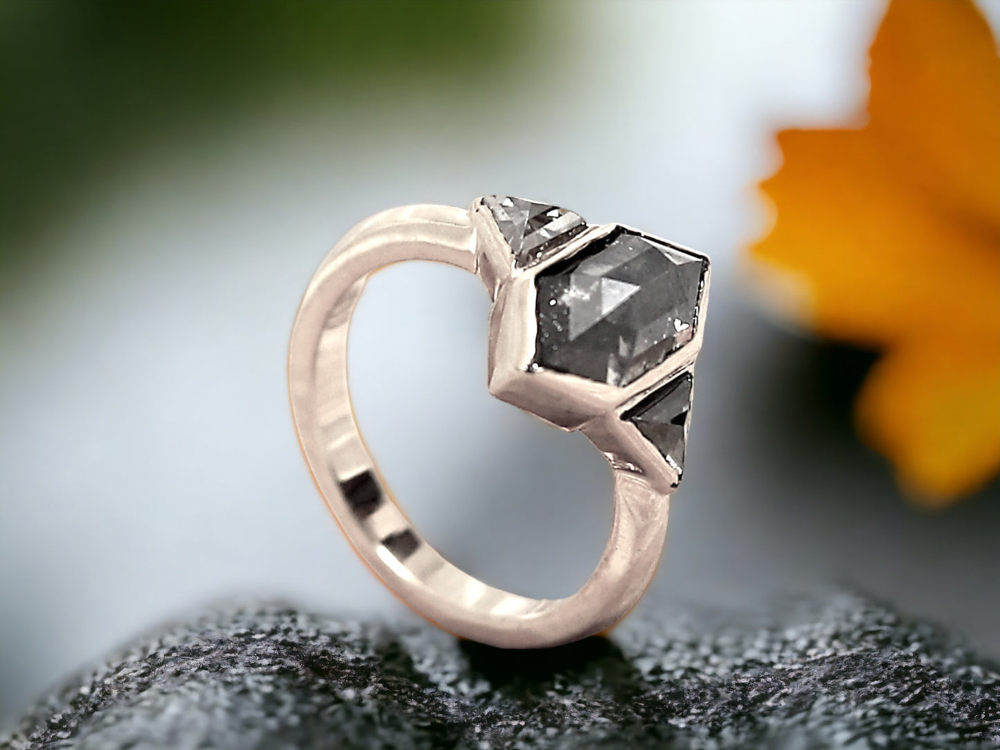 Hexagon Salt and Pepper Diamond Ring featuring a 2.07 CT natural hexagon cut salt and pepper diamond with galaxy-like inclusions, accented by triangle cut salt and pepper side stones in a rustic handmade contemporary design with a straight shank, created as an alternative engagement ring.