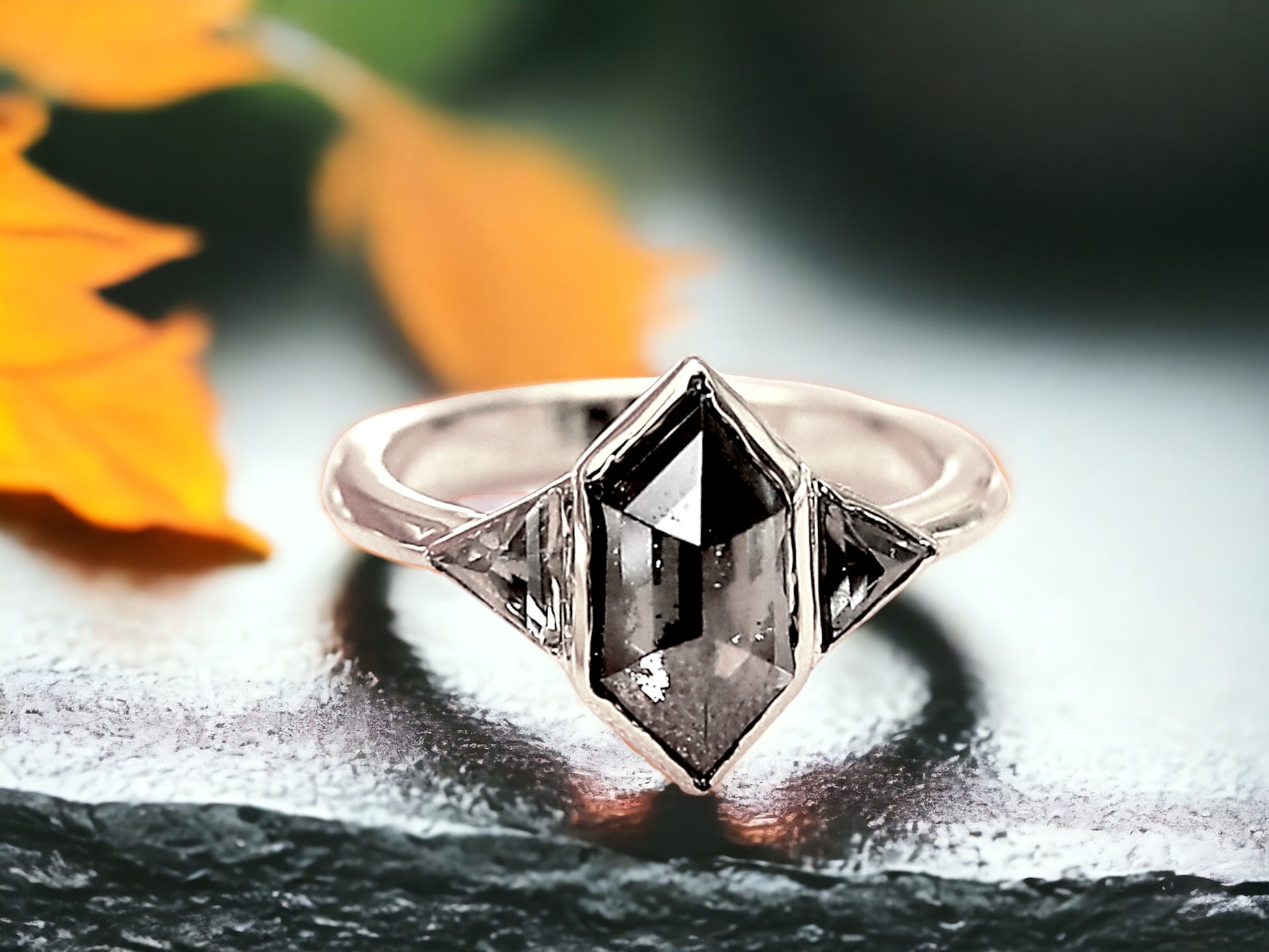 Hexagon Salt and Pepper Diamond Ring featuring a 2.07 CT natural hexagon cut salt and pepper diamond with galaxy-like inclusions, accented by triangle cut salt and pepper side stones in a rustic handmade contemporary design with a straight shank, created as an alternative engagement ring.