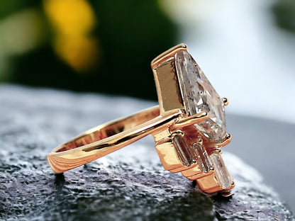 Kite Cut Salt and Pepper Diamond Ring featuring a 2.40 CT natural salt-and-pepper kite-cut diamond with galaxy-like inclusions, accented by 0.70 CT baguette-cut side stones in a minimalist geometric gold design with a straight 1.80 mm band.