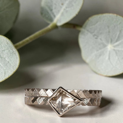 Kite cut salt and pepper diamond ring featuring a 0.55 CT natural diamond with unique inclusions, set on a straight band with zig zag engraved detailing in a handcrafted minimalist alternative engagement ring design.