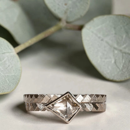 Kite cut salt and pepper diamond ring featuring a 0.55 CT natural diamond with unique inclusions, set on a straight band with zig zag engraved detailing in a handcrafted minimalist alternative engagement ring design.