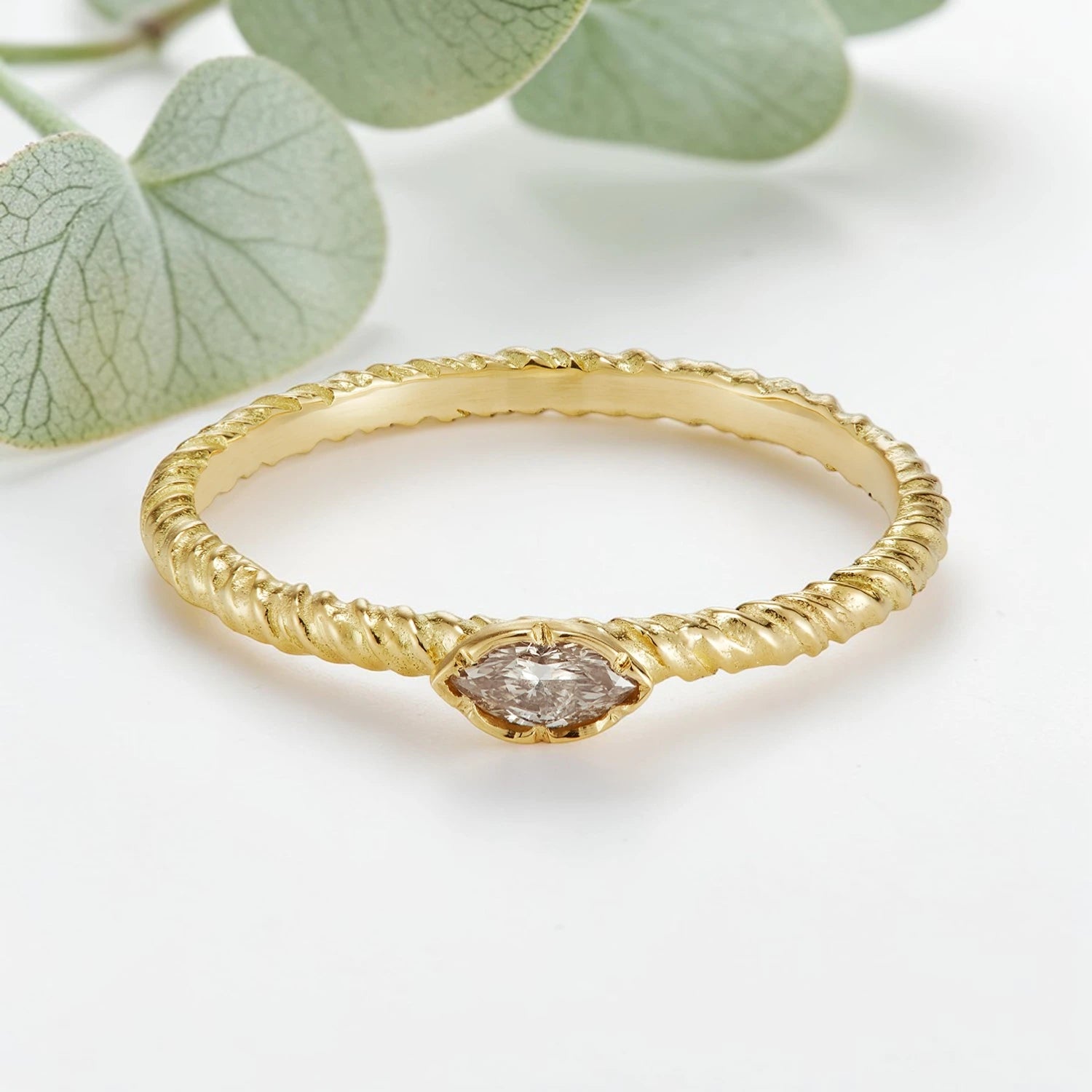 Marquise Cut Salt and Pepper Diamond Ring featuring a 0.20 CT natural salt and pepper diamond with subtle organic inclusions in a minimalist, lightweight,t fine jewellery design with a straight 1.80 mm band suitable for stacking and everyday wear.