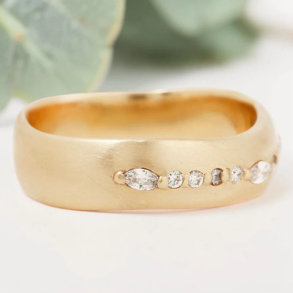 Marquise cut salt and pepper diamond wide statement ring featuring a 0.35 CT natural center stone with a 0.25 CT round cut accent diamond, handcrafted on a bold 5.65 mm straight band fine jewelry design.