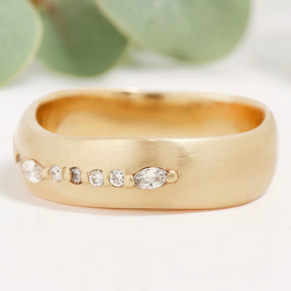 Marquise cut salt and pepper diamond wide statement ring featuring a 0.35 CT natural center stone with a 0.25 CT round cut accent diamond, handcrafted on a bold 5.65 mm straight band fine jewelry design.
