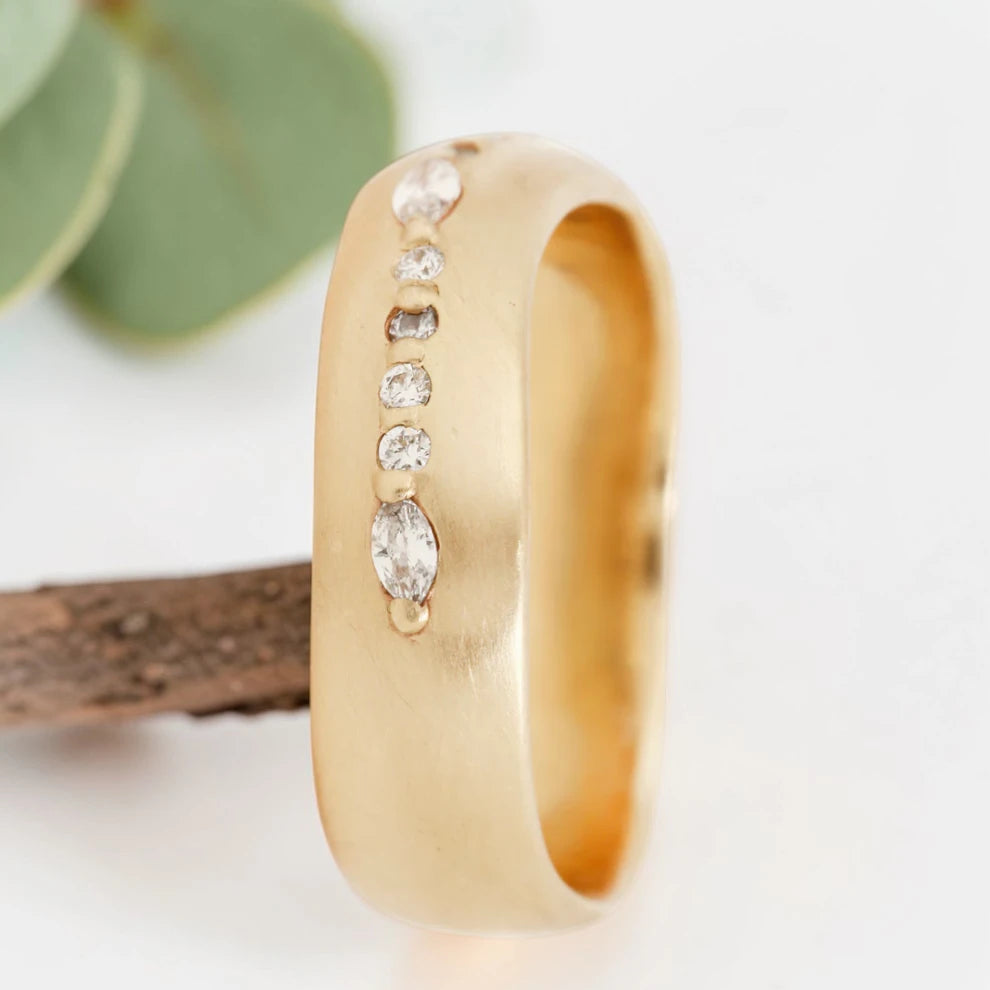 Marquise cut salt and pepper diamond wide statement ring featuring a 0.35 CT natural center stone with a 0.25 CT round cut accent diamond, handcrafted on a bold 5.65 mm straight band fine jewelry design.