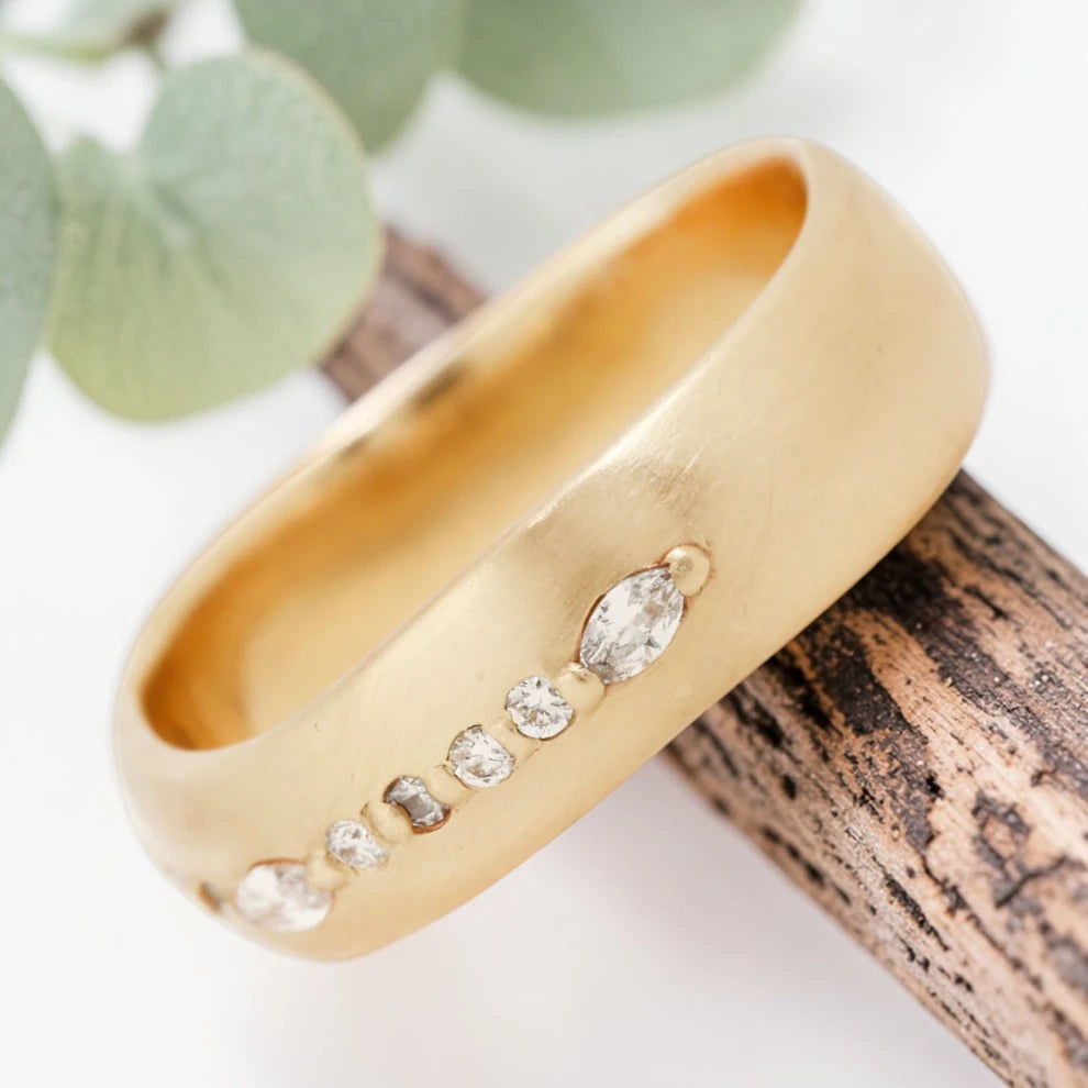 Marquise cut salt and pepper diamond wide statement ring featuring a 0.35 CT natural center stone with a 0.25 CT round cut accent diamond, handcrafted on a bold 5.65 mm straight band fine jewelry design.