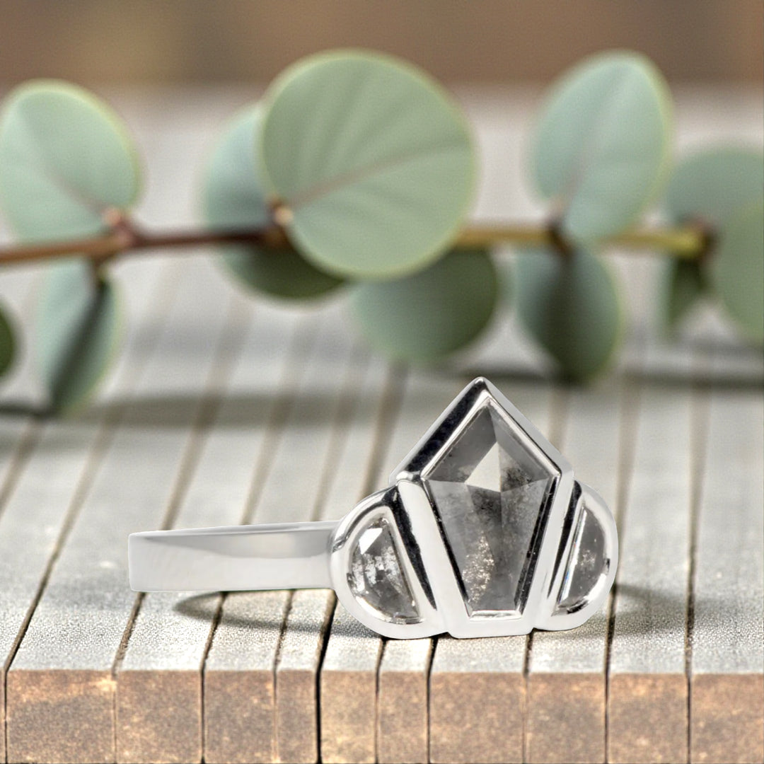 Obsidian Snow salt and pepper diamond ring featuring a natural organic diamond with black and white galaxy-like inclusions, handcrafted minimalist fine jewelry design showcasing raw natural beauty and elegant alternative engagement style.