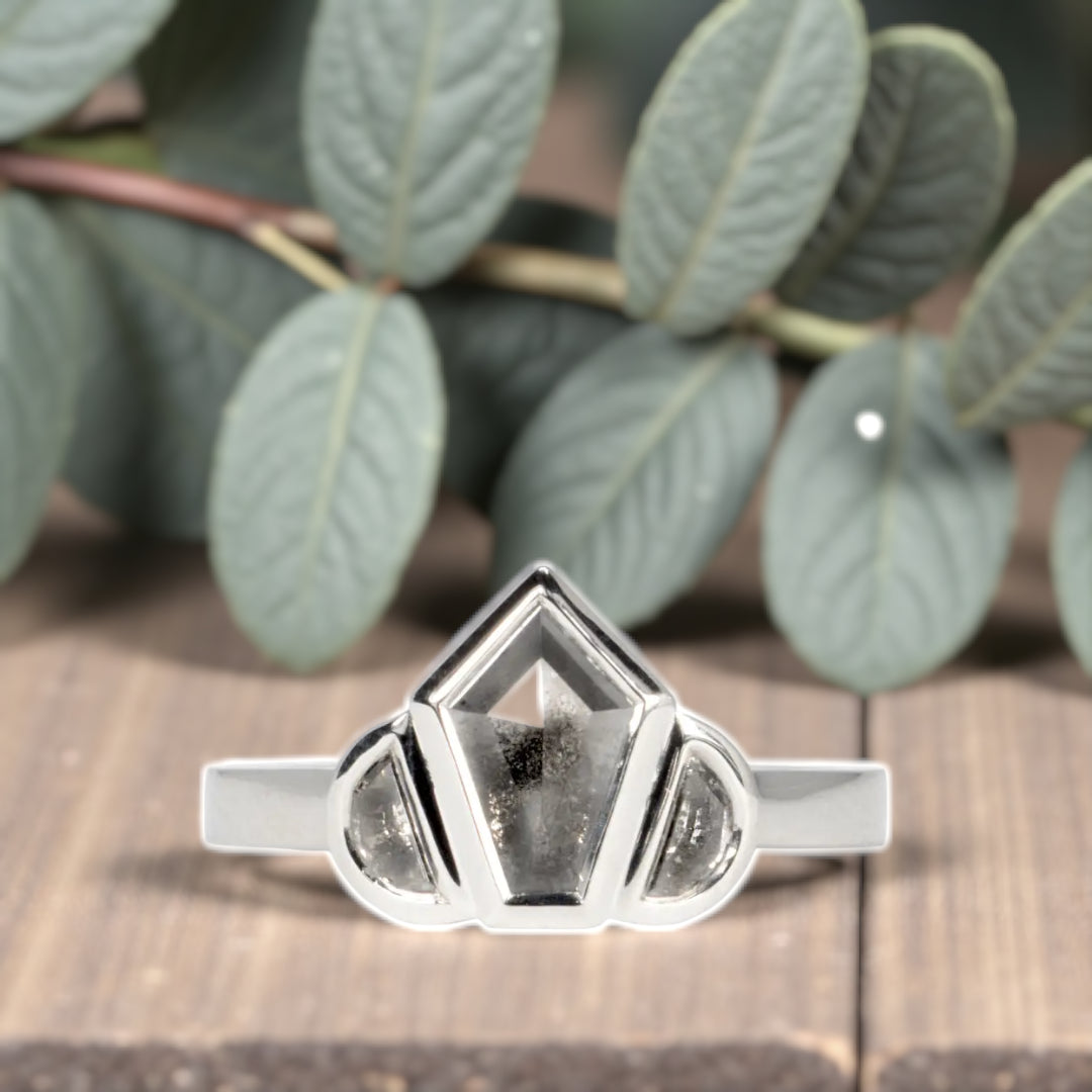 Obsidian Snow salt and pepper diamond ring featuring a natural organic diamond with black and white galaxy-like inclusions, handcrafted minimalist fine jewelry design showcasing raw natural beauty and elegant alternative engagement style.