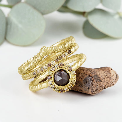 Organic Wide Band Salt and Pepper Diamond Ring featuring a 0.60 CT natural round center diamond with cognac champagne and black tones, surrounded by 27 salt and pepper diamonds in a handmade minimalist wide band design with organic aesthetic.