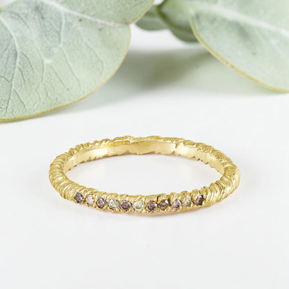 Organic Wide Band Salt and Pepper Diamond Ring featuring a 0.60 CT natural round center diamond with cognac champagne and black tones, surrounded by 27 salt and pepper diamonds in a handmade minimalist wide band design with organic aesthetic.