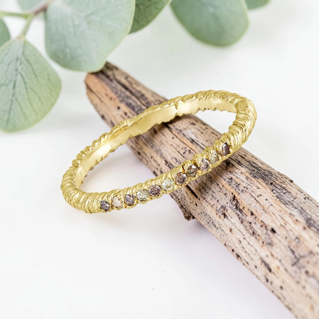 Organic Wide Band Salt and Pepper Diamond Ring featuring a 0.60 CT natural round center diamond with cognac champagne and black tones, surrounded by 27 salt and pepper diamonds in a handmade minimalist wide band design with organic aesthetic.