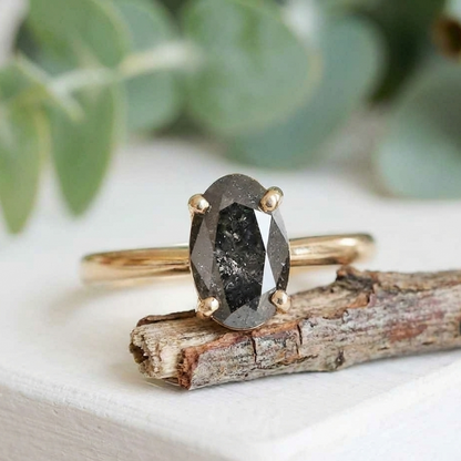 Oval Salt and Pepper Diamond Ring featuring a 2.07 CT natural salt and pepper diamond with galaxy-like internal inclusions in a minimalist design with a straight 1.90 mm band, crafted as a modern fine jewelry engagement and everyday wear ring.