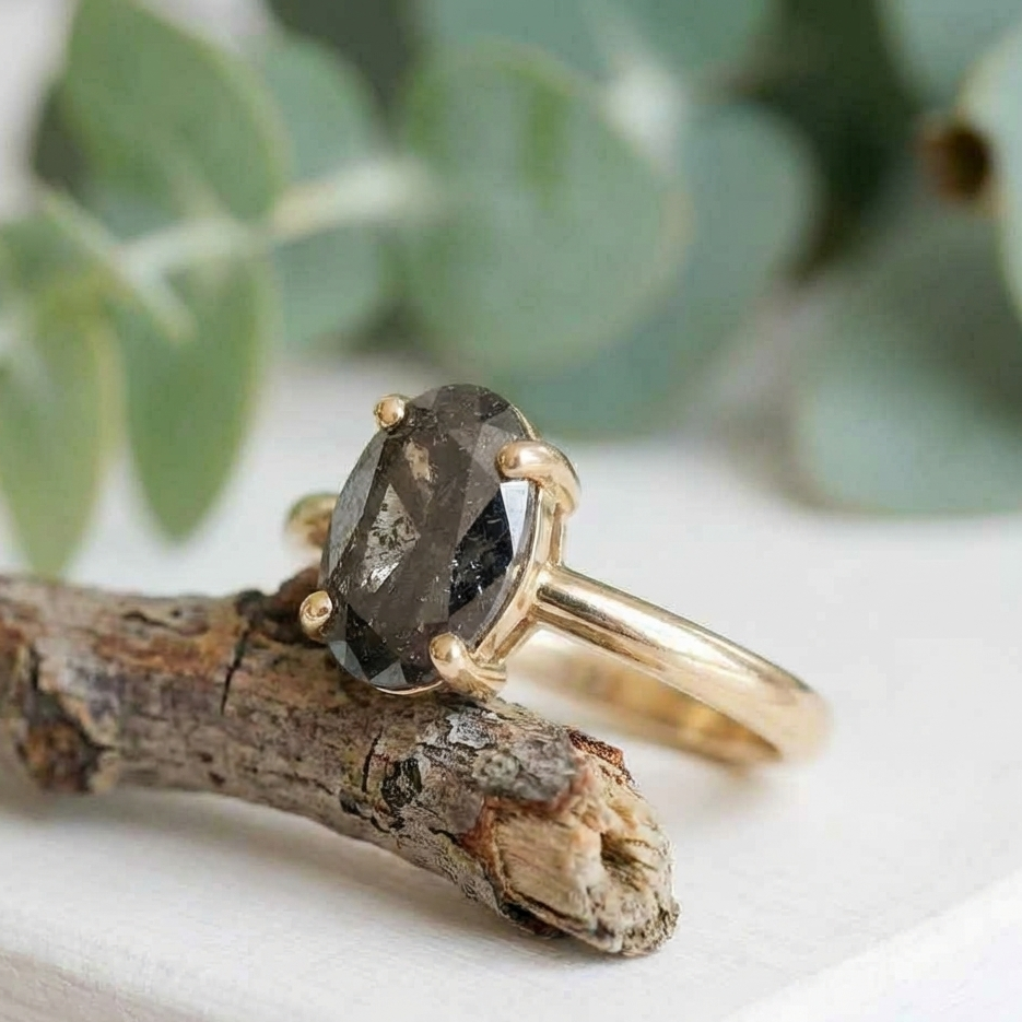 Oval Salt and Pepper Diamond Ring featuring a 2.07 CT natural salt and pepper diamond with galaxy-like internal inclusions in a minimalist design with a straight 1.90 mm band, crafted as a modern fine jewelry engagement and everyday wear ring.