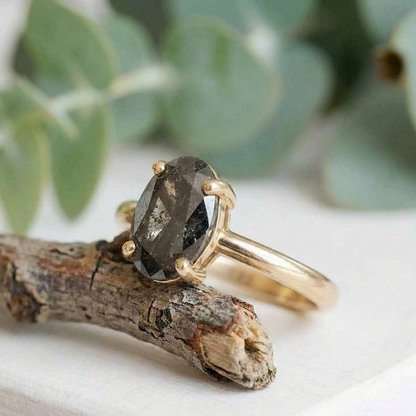 Oval Salt and Pepper Diamond Ring featuring a 2.07 CT natural salt and pepper diamond with galaxy-like internal inclusions in a minimalist design with a straight 1.90 mm band, crafted as a modern fine jewelry engagement and everyday wear ring.