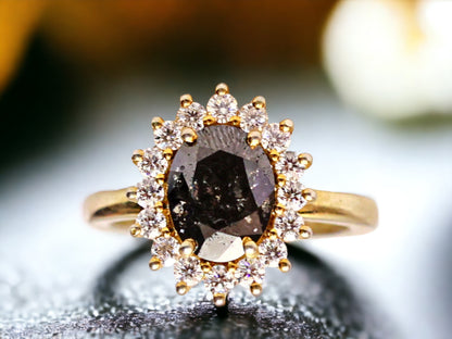 Oval Salt and Pepper Diamond Ring featuring a 2.10 CT natural salt and pepper diamond with galaxy-like inclusions, accented by round brilliant diamonds in a handcrafted bezel setting with a reverse tapered 2.50 mm band, designed as a minimalist statement engagement ring.