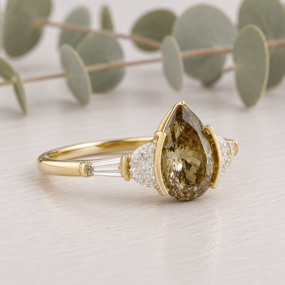 Pear Cut Fancy Color Diamond Ring featuring a 1.38 CT pear cut fancy color diamond with brown yellow tones, accented by lab-grown diamonds in a classic contemporary setting with a straight shank and slim 1.8 mm band, designed as a unique engagement ring