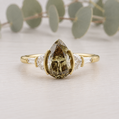 Pear Cut Fancy Color Diamond Ring featuring a 1.38 CT pear cut fancy color diamond with brown yellow tones, accented by lab-grown diamonds in a classic contemporary setting with a straight shank and slim 1.8 mm band, designed as a unique engagement ring.