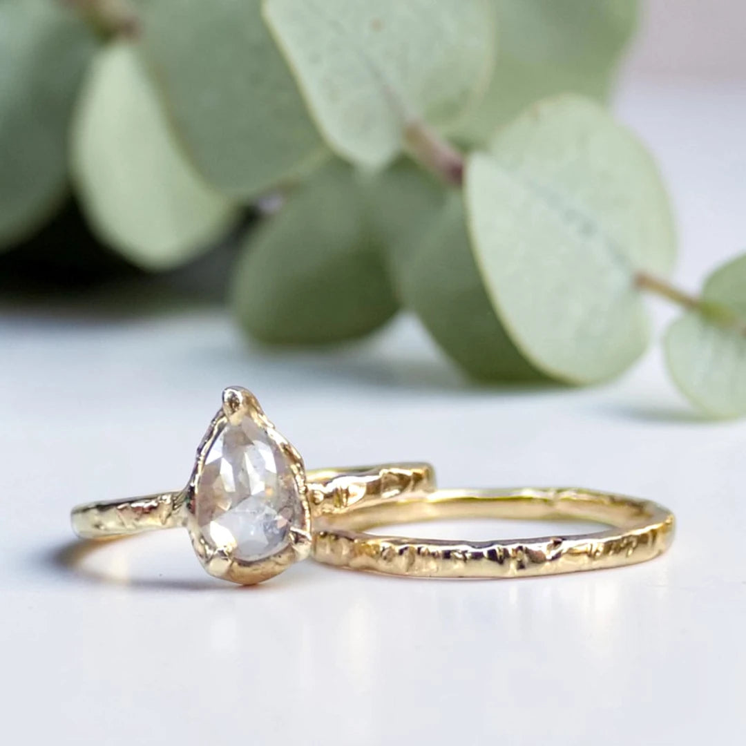 Pear Cut Salt and Pepper Diamond Ring featuring a 0.95 CT natural salt and pepper diamond with unique organic inclusions in a rustic bezel-inspired setting, crafted in a handcrafted vintage-inspired fine jewelry design with a straight 1.90 mm band for alternative bridal styling.