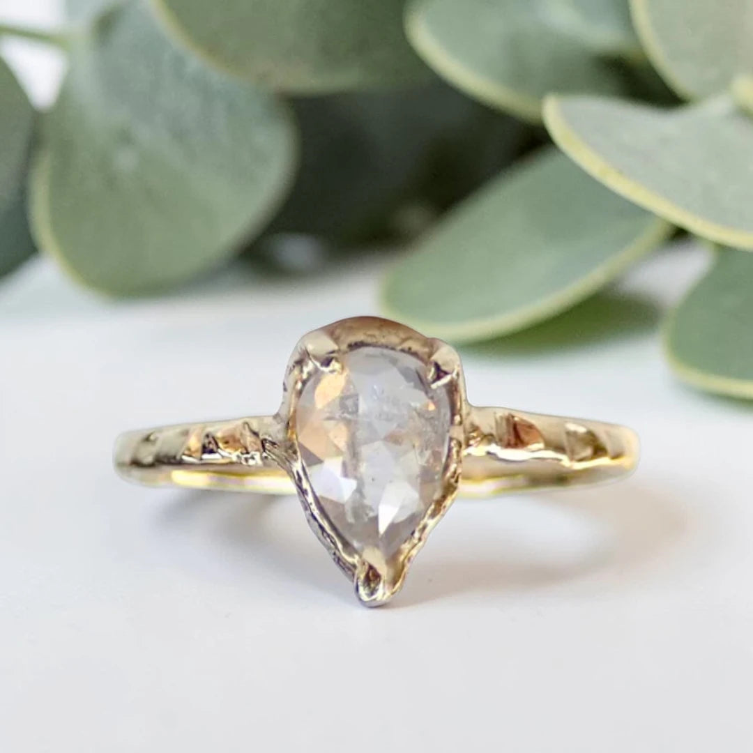 Pear Cut Salt and Pepper Diamond Ring featuring a 0.95 CT natural salt and pepper diamond with unique organic inclusions in a rustic bezel-inspired setting, crafted in a handcrafted vintage-inspired fine jewelry design with a straight 1.90 mm band for alternative bridal styling.