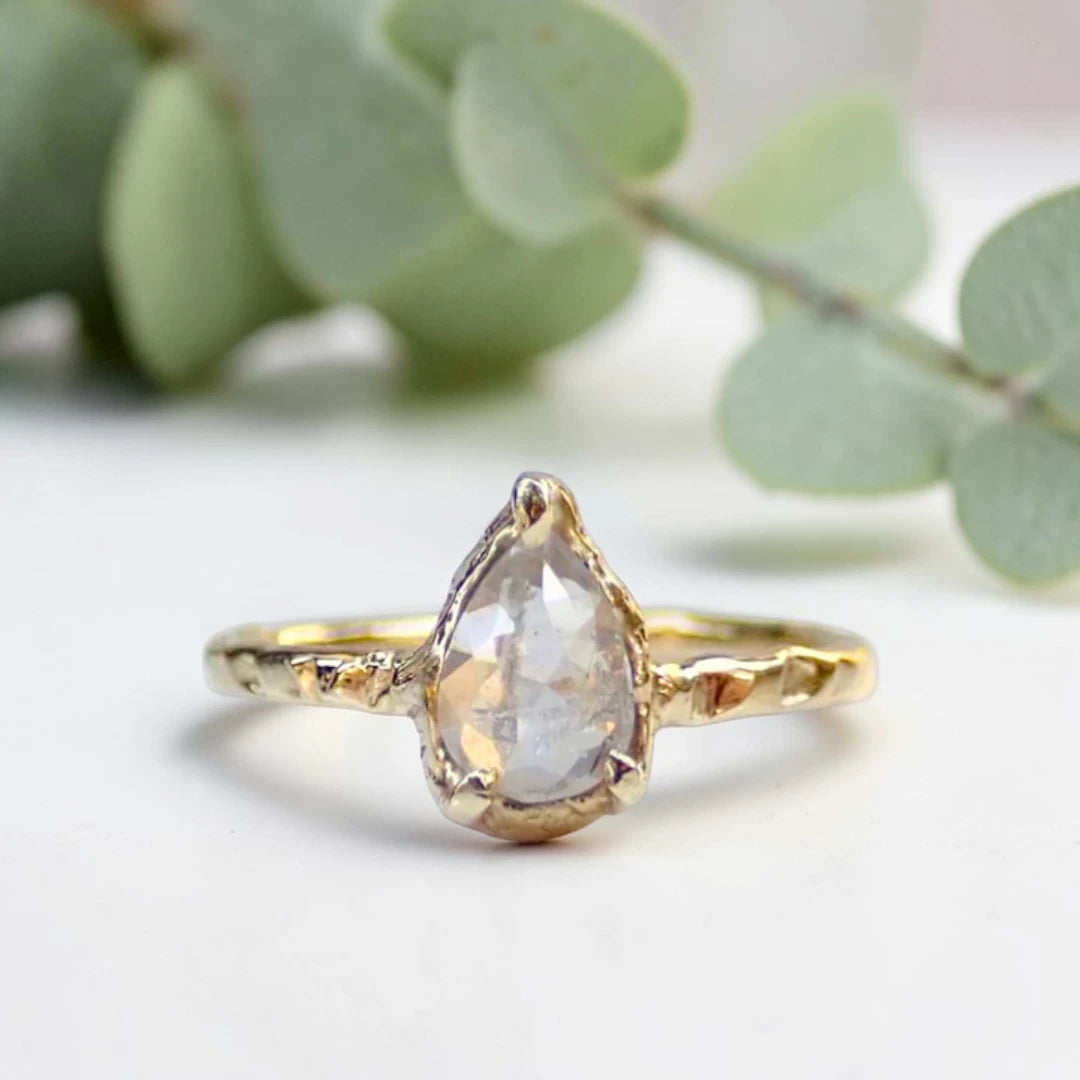 Pear Cut Salt and Pepper Diamond Ring featuring a 0.95 CT natural salt and pepper diamond with unique organic inclusions in a rustic bezel-inspired setting, crafted in a handcrafted vintage-inspired fine jewelry design with a straight 1.90 mm band for alternative bridal styling.