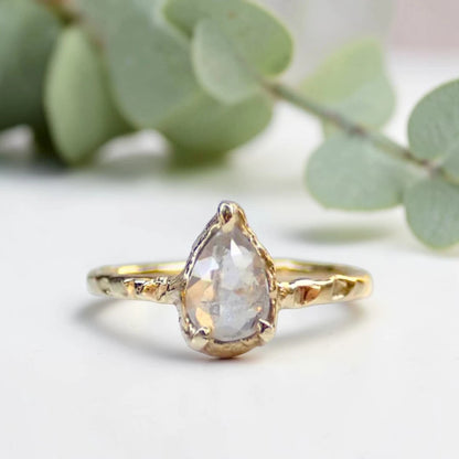 Pear Cut Salt and Pepper Diamond Ring featuring a 0.95 CT natural salt and pepper diamond with unique organic inclusions in a rustic bezel-inspired setting, crafted in a handcrafted vintage-inspired fine jewelry design with a straight 1.90 mm band for alternative bridal styling.