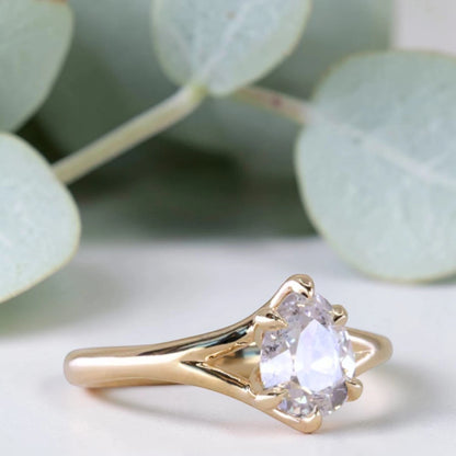 Pear cut salt and pepper diamond engagement ring featuring a 1.21 CT natural diamond with unique inclusions, set on a handcrafted split shank band in a minimalist alternative bridal jewelry design.