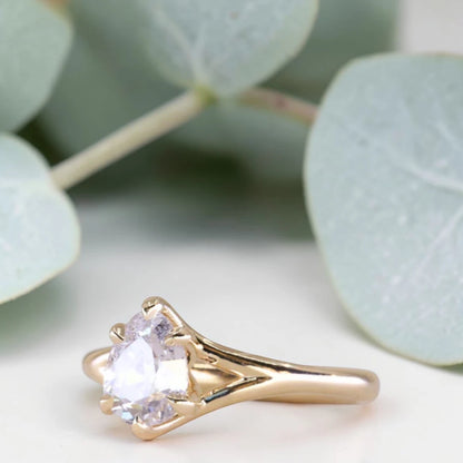 Pear cut salt and pepper diamond engagement ring featuring a 1.21 CT natural diamond with unique inclusions, set on a handcrafted split shank band in a minimalist alternative bridal jewelry design.