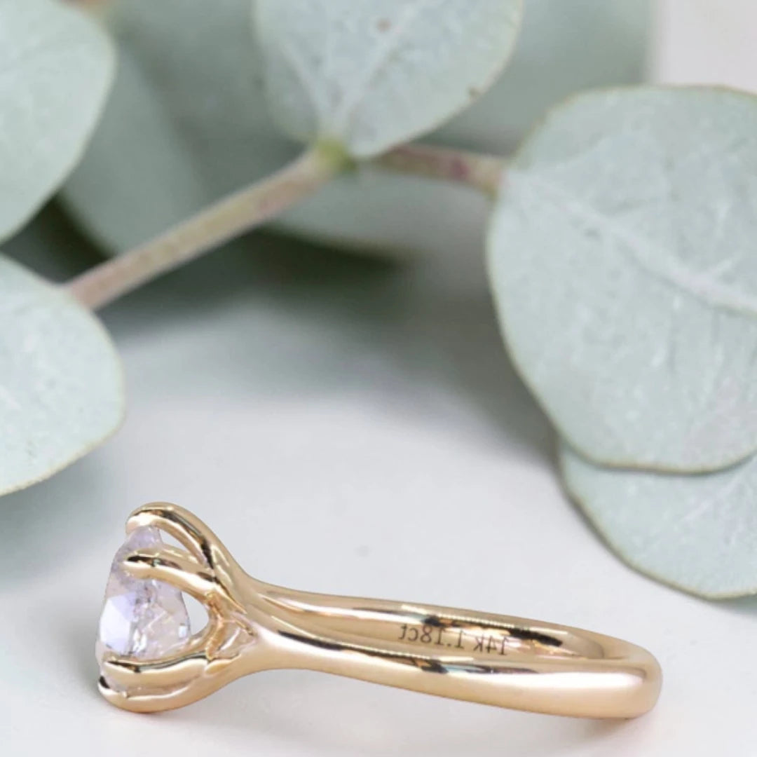 Pear cut salt and pepper diamond engagement ring featuring a 1.21 CT natural diamond with unique inclusions, set on a handcrafted split shank band in a minimalist alternative bridal jewelry design.